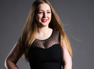smiling young woman in black dress