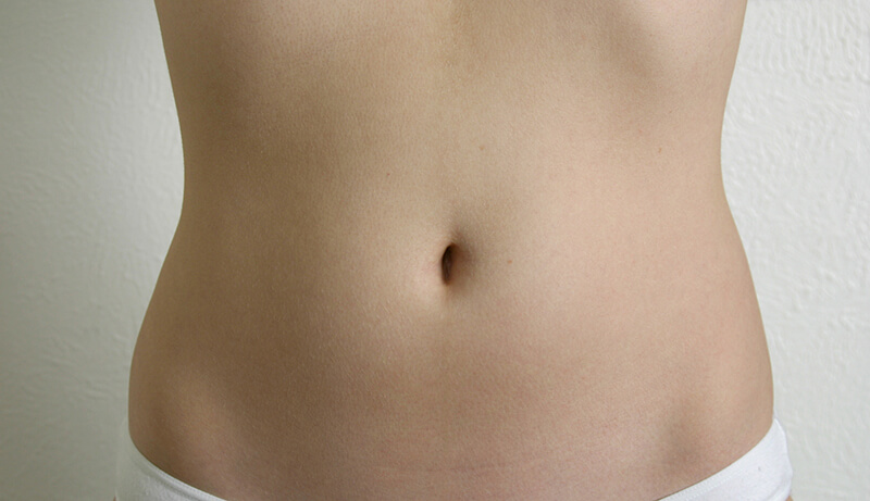 Curvy, smooth woman's belly photo