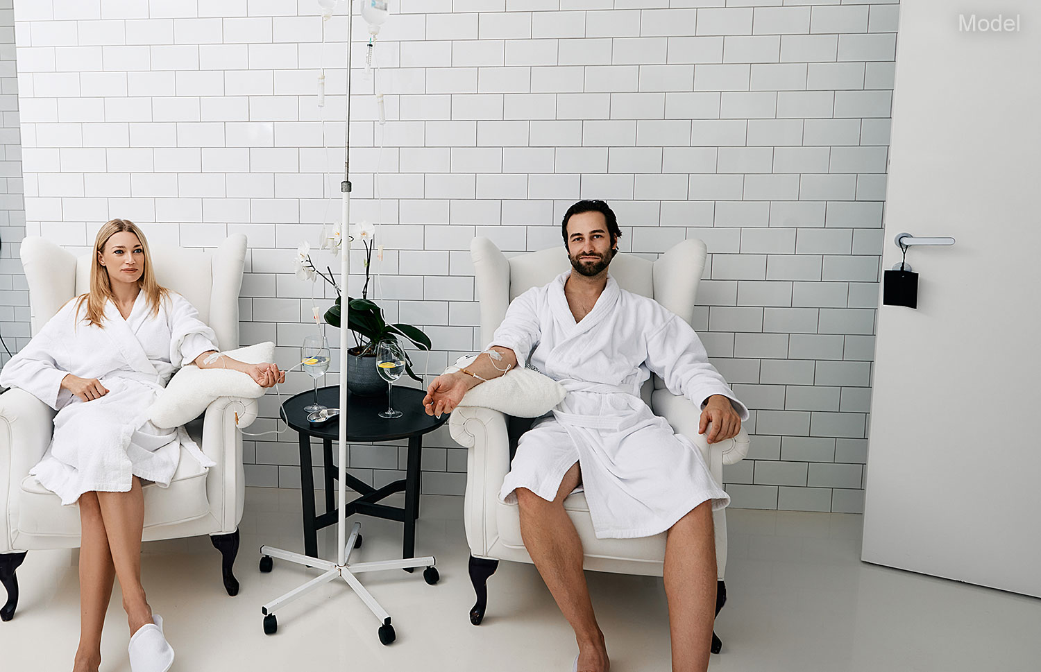 Beautiful couple during intravenous vitamin therapy to boosting the immune system Beautiful couple during intravenous vitamin therapy to boosting the immune system