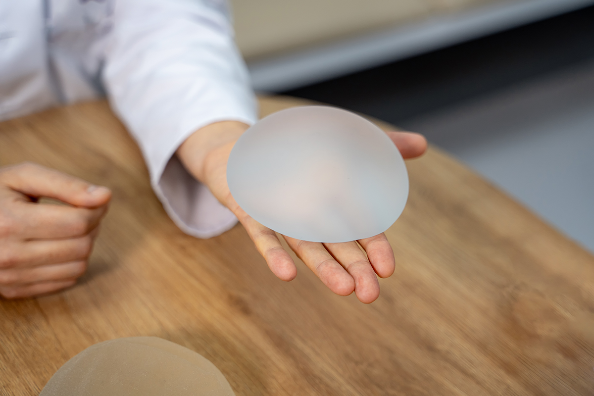 silicone breast implant in doctors hands
